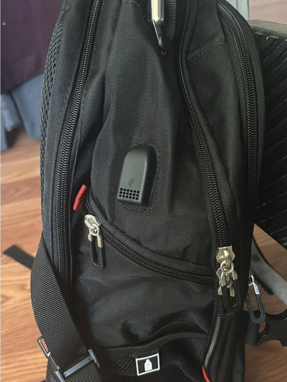 Black Travel Backpack with Red Accents